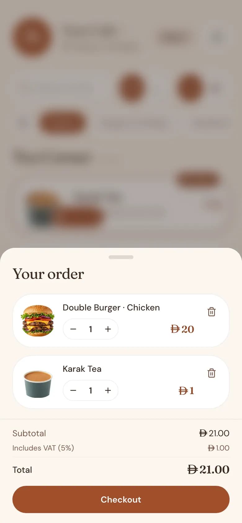 A customer's cart on the digital menu, listing the chosen items and the total in AED