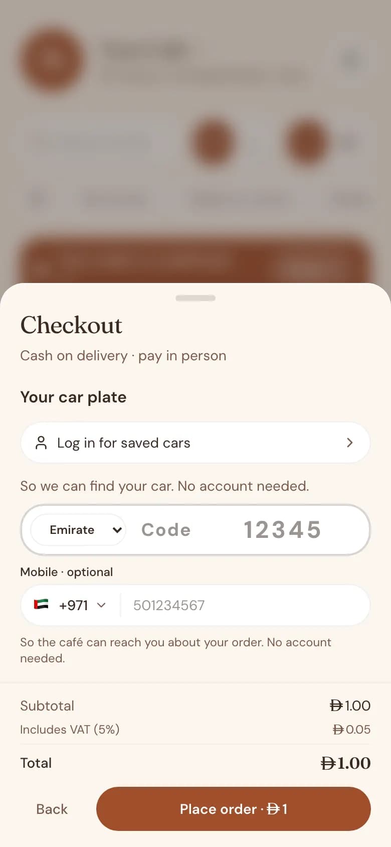 Car order checkout on a phone asking for the plate number and emirate