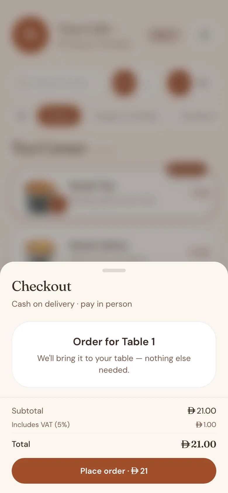 The dine-in checkout on a phone, showing the table, the order total and the payment choice